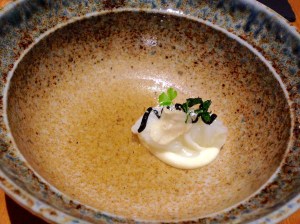 Smoked potato puree, translucent Japanese squid, barely sprouted greens, a snowy sprinkling of Iberico ham lard powder and squiggles of squid ink. The waiter then poured on a ham broth.